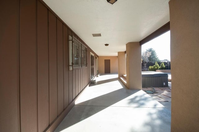 view of patio / terrace featuring a hot tub