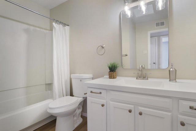 full bathroom featuring vanity, toilet, hardwood / wood-style floors, and shower / bath combo