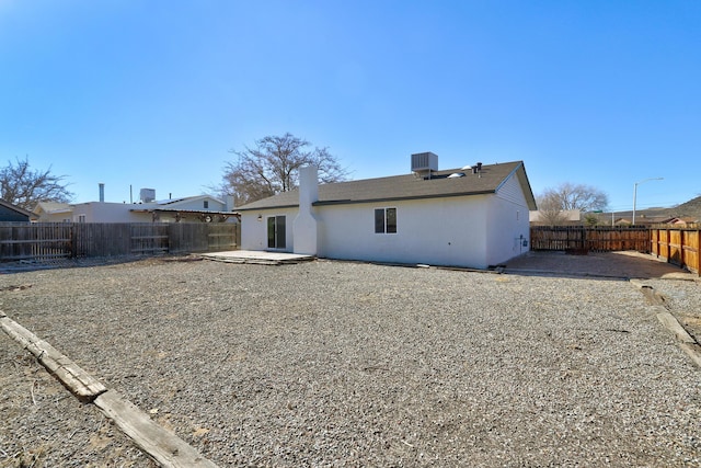 back of property featuring a patio and cooling unit