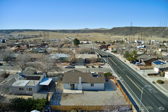 birds eye view of property with a mountain view