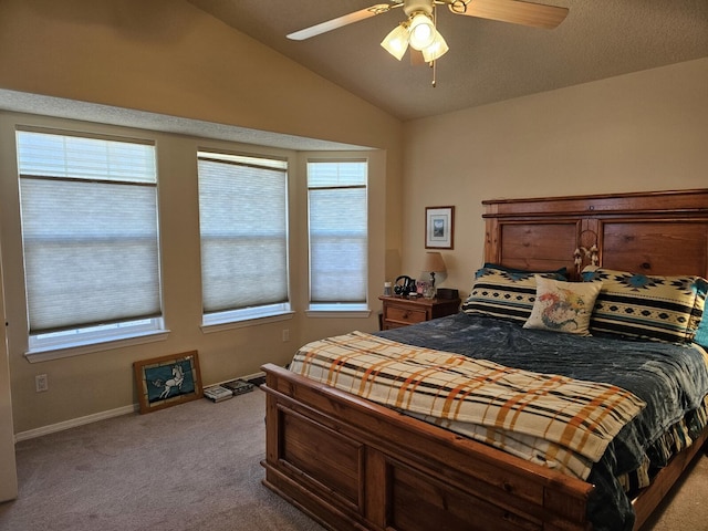 carpeted bedroom featuring lofted ceiling and ceiling fan