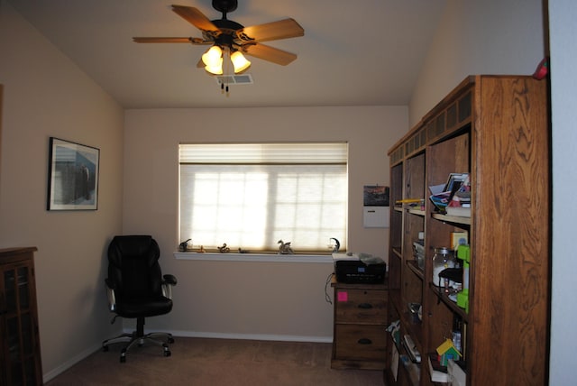 interior space featuring dark carpet and ceiling fan