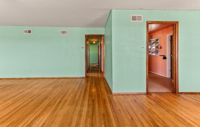 spare room featuring light wood-type flooring