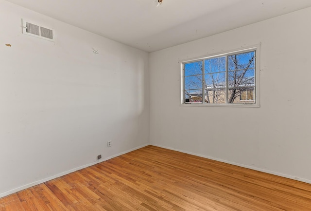 empty room with light hardwood / wood-style floors