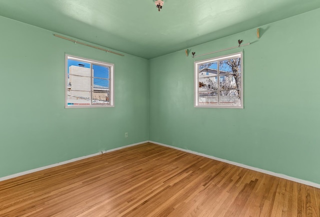 empty room with light hardwood / wood-style floors