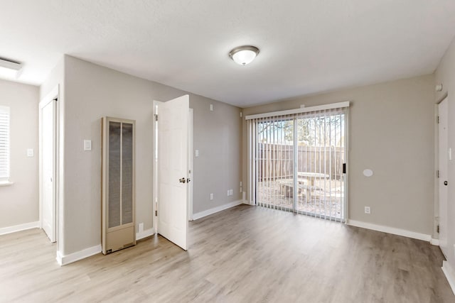 unfurnished room featuring light hardwood / wood-style floors