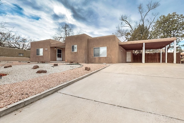 southwest-style home featuring a carport