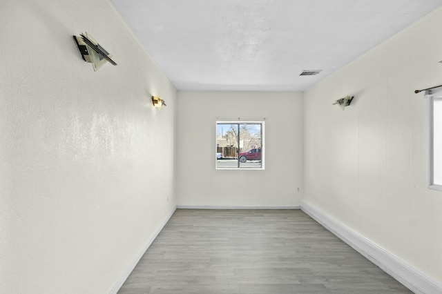 unfurnished room with light hardwood / wood-style floors