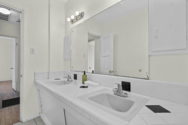 bathroom featuring hardwood / wood-style flooring and vanity