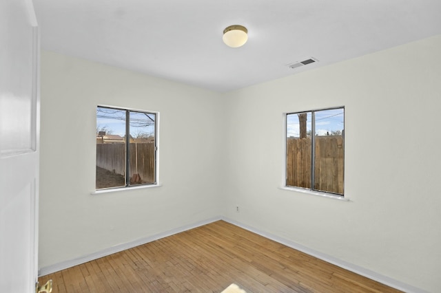 empty room featuring hardwood / wood-style floors