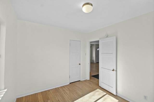 unfurnished bedroom with light hardwood / wood-style floors