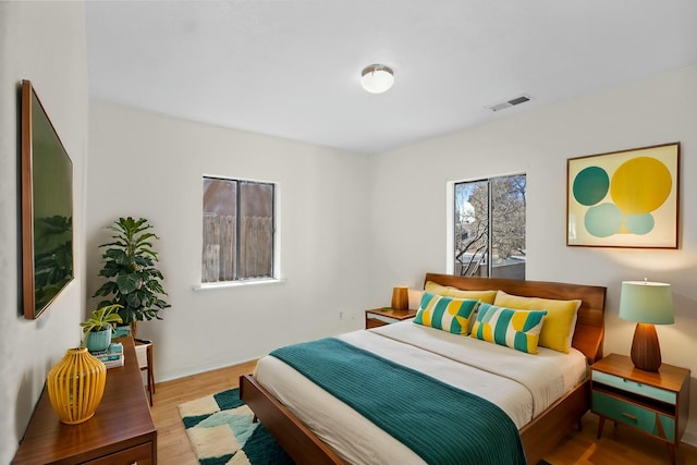 bedroom with light hardwood / wood-style flooring