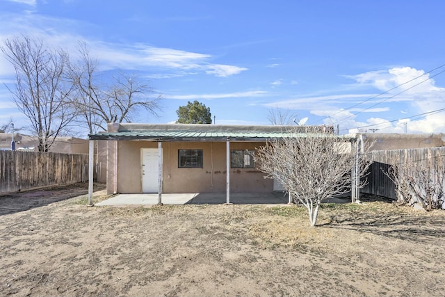 rear view of house with a patio