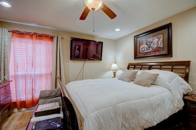 bedroom featuring wood-type flooring and ceiling fan