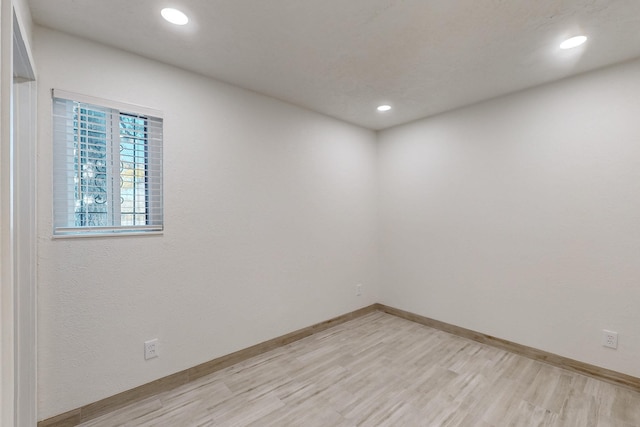 spare room with light hardwood / wood-style floors