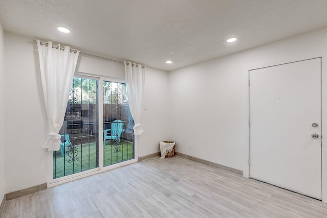 empty room featuring light hardwood / wood-style floors