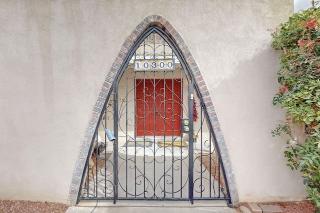 exterior details with a gate and arched walkways