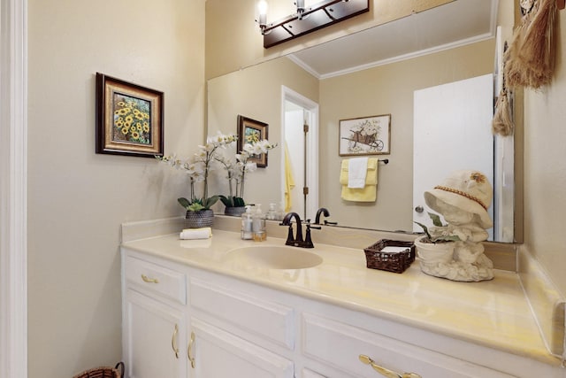 bathroom with ornamental molding and vanity