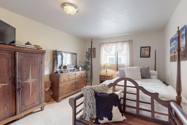 bedroom with light carpet