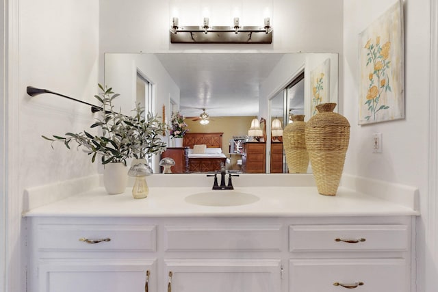 ensuite bathroom with connected bathroom and vanity
