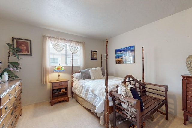 bedroom featuring light carpet