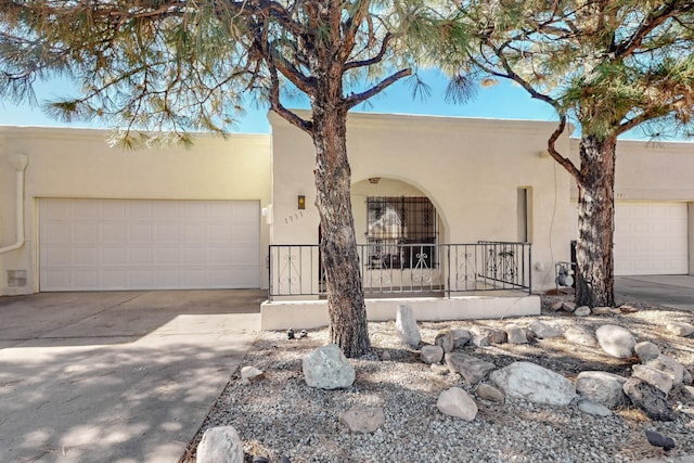 southwest-style home featuring a garage