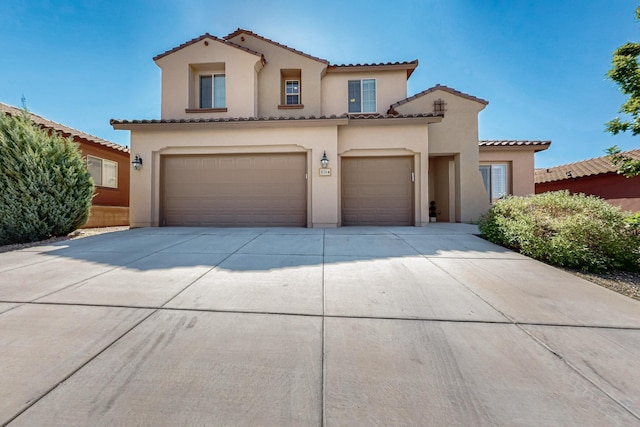 836 Mesa Roja Trl NE, Rio Rancho, NM 87144 - mediterranean / spanish-style house with stucco siding, concrete driveway, a tile roof, and a garage