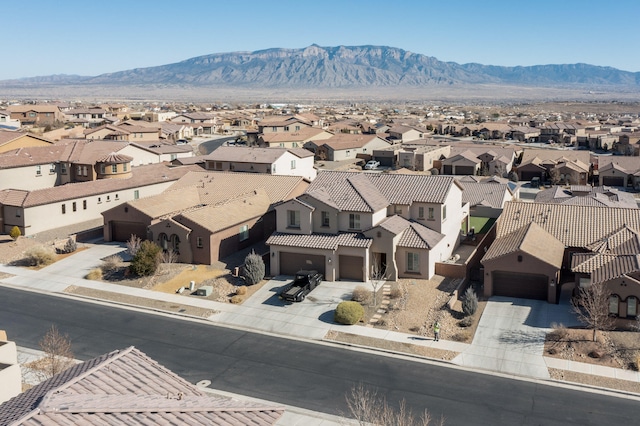 birds eye view of property with a mountain view