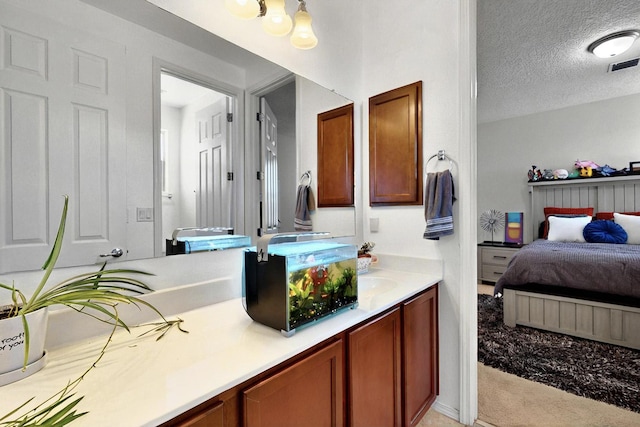 836 Mesa Roja Trl NE, Rio Rancho, NM 87144 - ensuite bathroom featuring a textured ceiling and double vanity