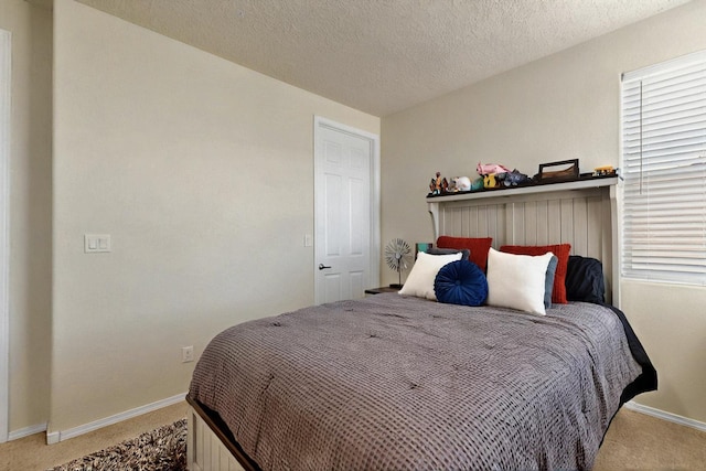 836 Mesa Roja Trl NE, Rio Rancho, NM 87144 - carpeted bedroom featuring baseboards, a textured ceiling, and multiple windows