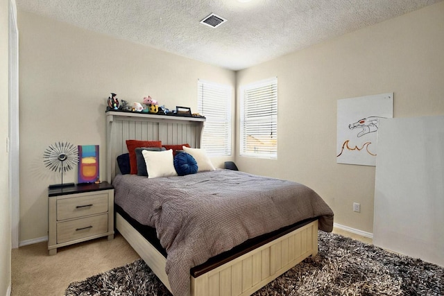 836 Mesa Roja Trl NE, Rio Rancho, NM 87144 - bedroom with light colored carpet, baseboards, and a textured ceiling