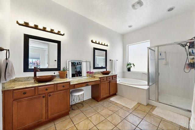 836 Mesa Roja Trl NE, Rio Rancho, NM 87144 - bathroom with a shower stall, vanity, a bath, tile patterned floors, and a textured ceiling