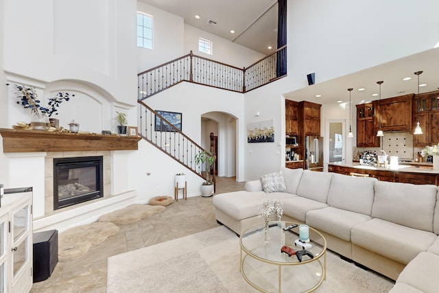 living room with a tiled fireplace