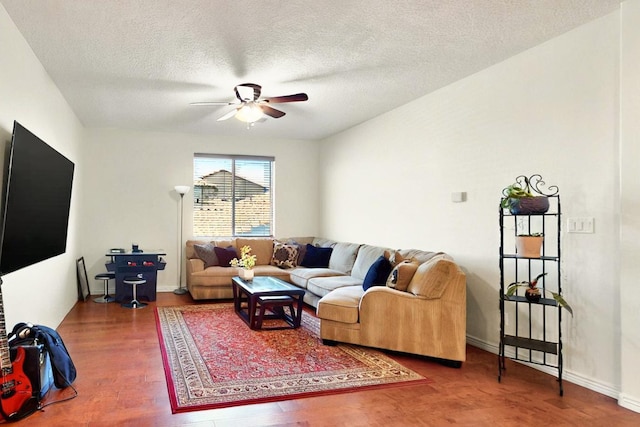 836 Mesa Roja Trl NE, Rio Rancho, NM 87144 - living room with a ceiling fan, wood finished floors, a textured ceiling, and baseboards