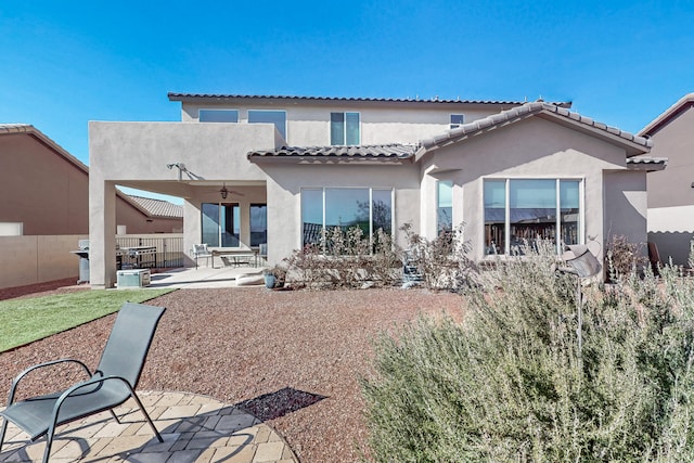 back of house with a patio area and ceiling fan