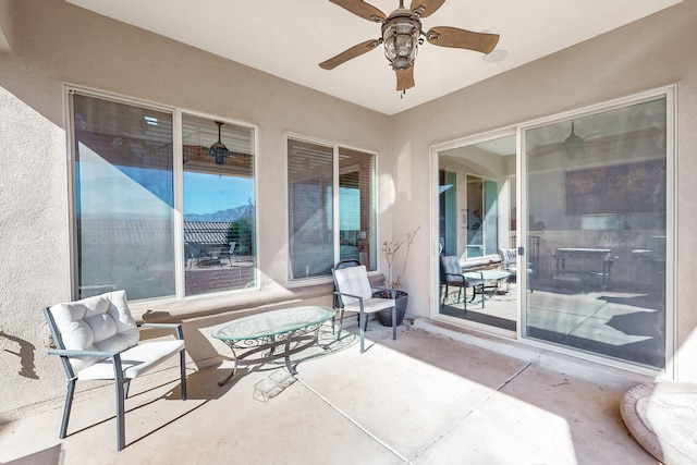 view of patio / terrace featuring ceiling fan