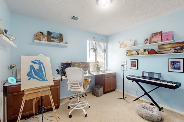 carpeted office with a textured ceiling