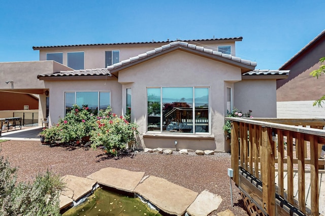 836 Mesa Roja Trl NE, Rio Rancho, NM 87144 - rear view of property with a tile roof and stucco siding