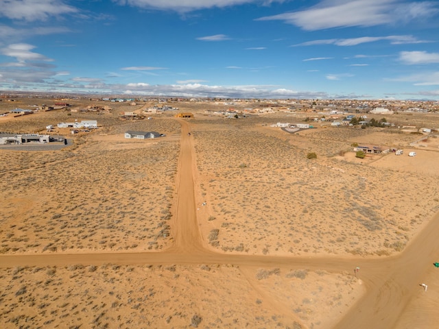 birds eye view of property featuring view of desert