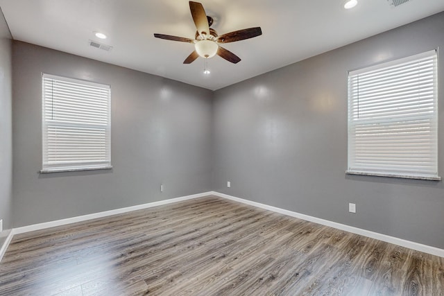 empty room featuring ceiling fan and wood-type flooring