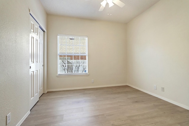 unfurnished room featuring ceiling fan and light hardwood / wood-style flooring