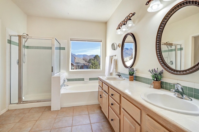 bathroom with vanity, shower with separate bathtub, and tile patterned flooring