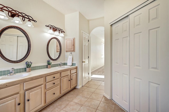 bathroom with vanity and tile patterned floors