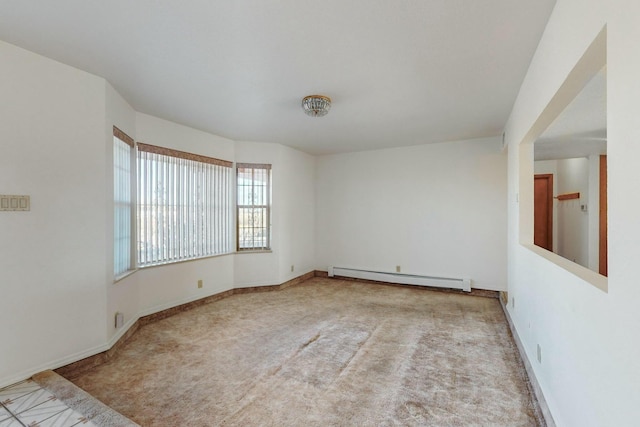 carpeted spare room featuring a baseboard radiator