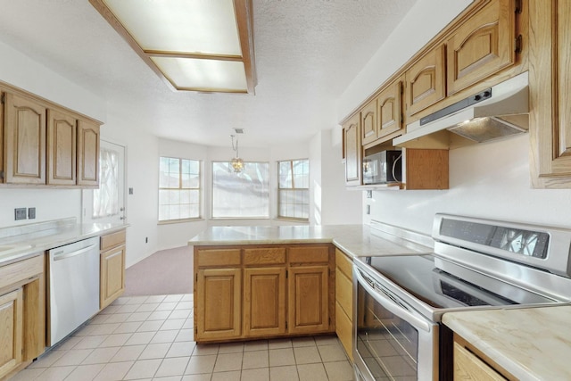 kitchen with light tile patterned floors, hanging light fixtures, stainless steel appliances, a textured ceiling, and kitchen peninsula