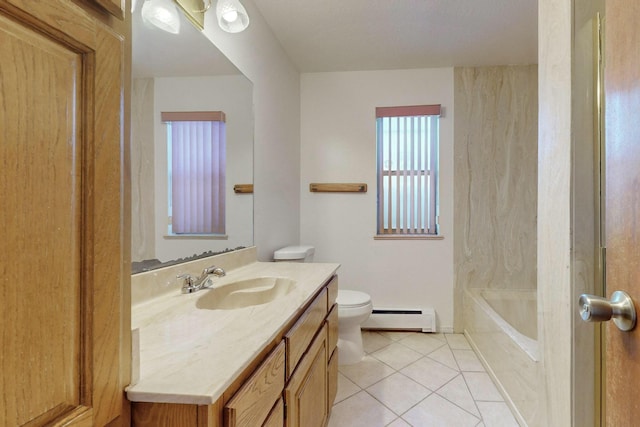 bathroom with a tub to relax in, vanity, a baseboard heating unit, toilet, and tile patterned floors