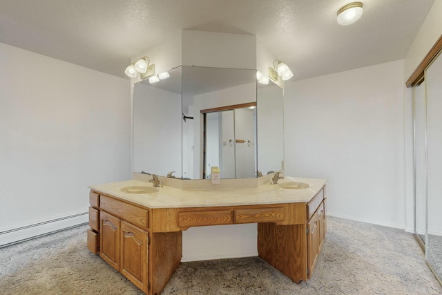 bathroom featuring vanity and a baseboard radiator