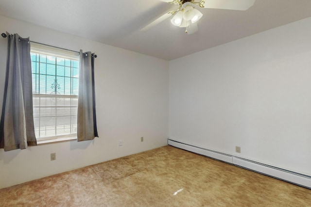 carpeted spare room featuring baseboard heating and ceiling fan