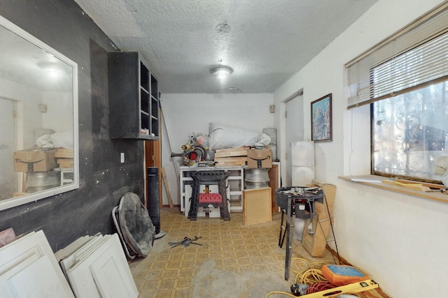 interior space with a textured ceiling