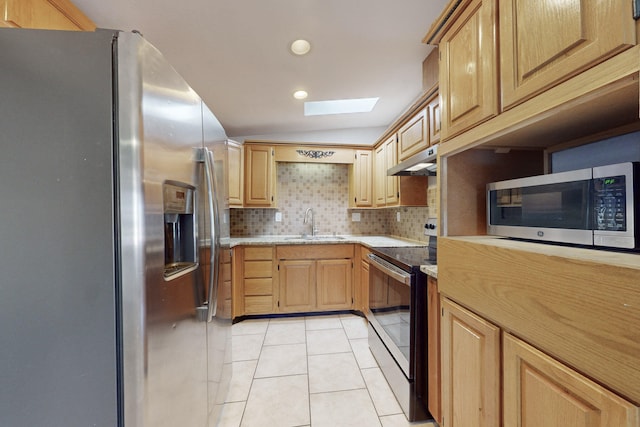 kitchen with light brown cabinetry, tasteful backsplash, sink, light tile patterned floors, and stainless steel appliances